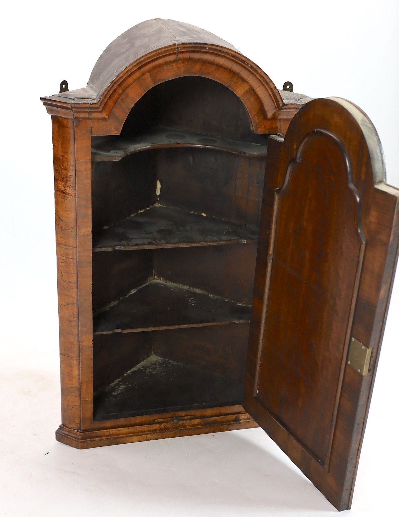 A Queen Anne walnut hanging corner cupboard, width 64cm, depth 34cm, height 104cm